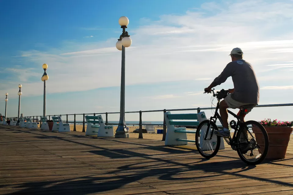 Person on bike on New Jersey boardwalk.